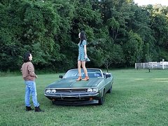 Girl Having Fun On Top Of Car