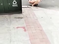 Chinese Woman Pees In The Street
