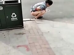 Chinese Woman Pees In The Street